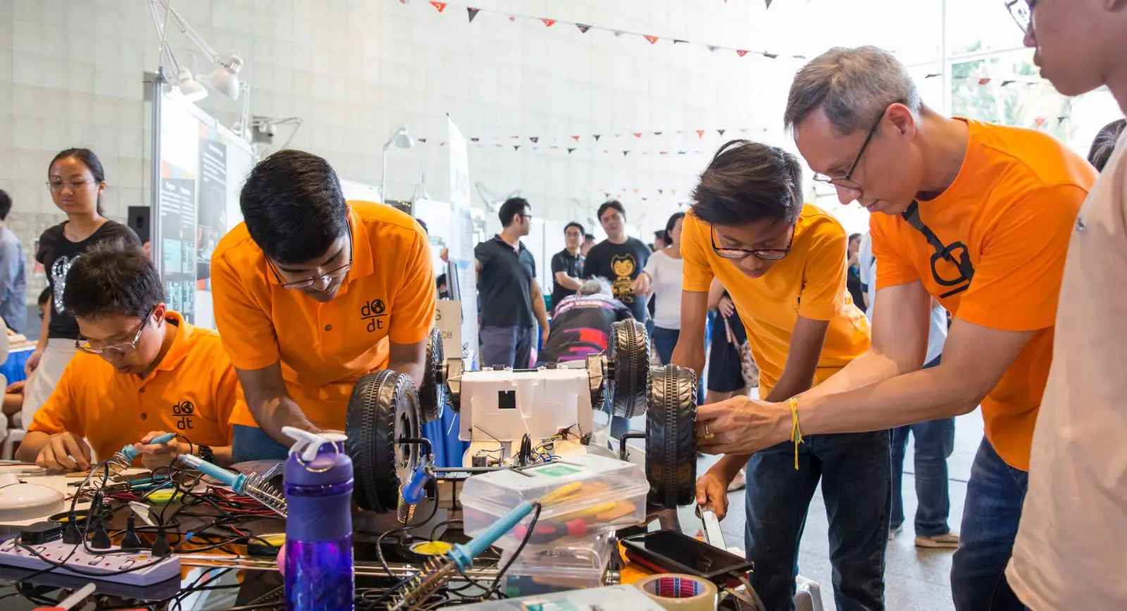 Volunteers at Tech For Good festival by Engineering Good, a charity in Singapore creating open-source assistive technology solutions for seniors and the disability community.