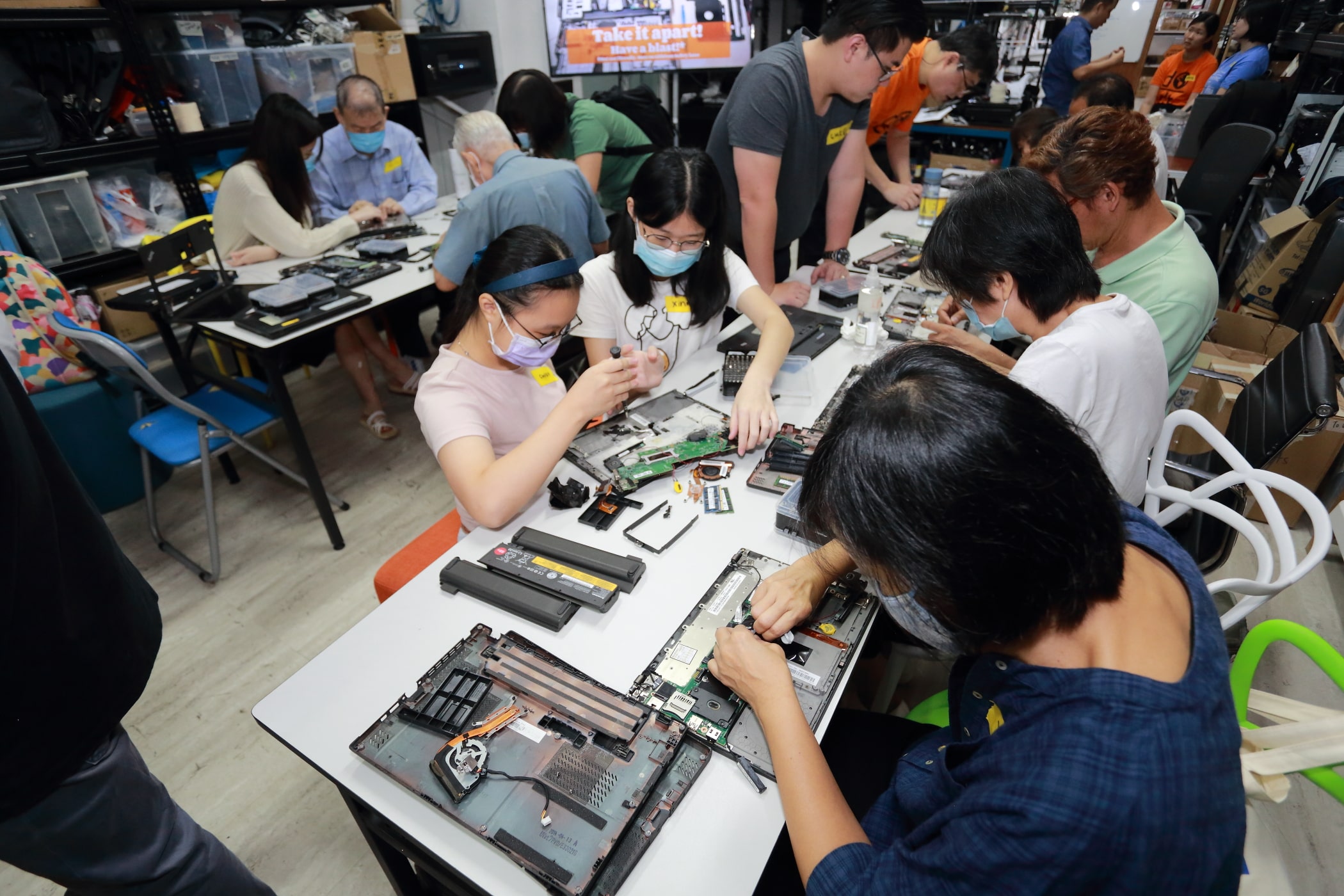 volunteers reducing e-waste with engineering good